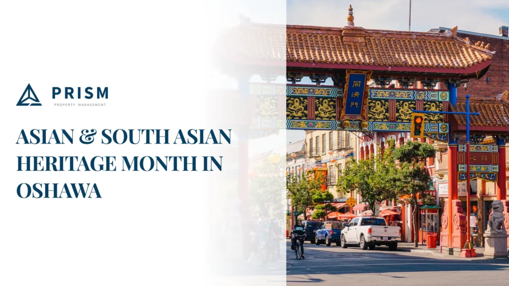 A vibrant street scene with a traditional Asian archway, promoting "Asian & South Asian Heritage Month in Oshawa" alongside a property management logo.