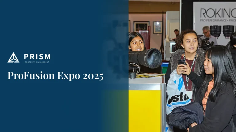 A split image featuring a deep blue background on the left with the "PRISM PROPERTY MANAGEMENT" logo and text "ProFusion Expo 2025." The right side of the image shows three young people at an event booth, with one holding a large camera lens and another looking at a phone, and a "ROKINON" banner visible in the background.