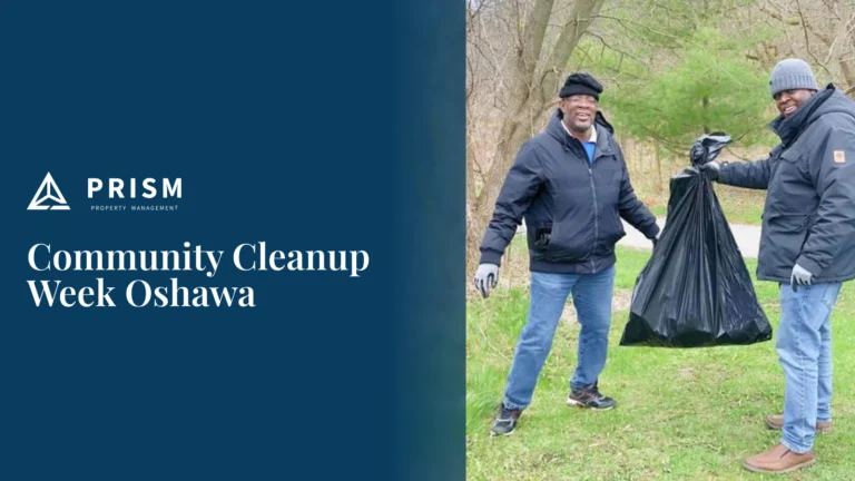 Two volunteers holding a full trash bag during Community Cleanup Week in Oshawa.