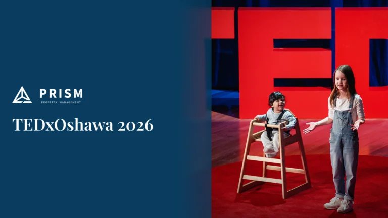 A young girl stands and speaks next to a seated child on stage in front of large red TED letters at TEDxOshawa 2026.